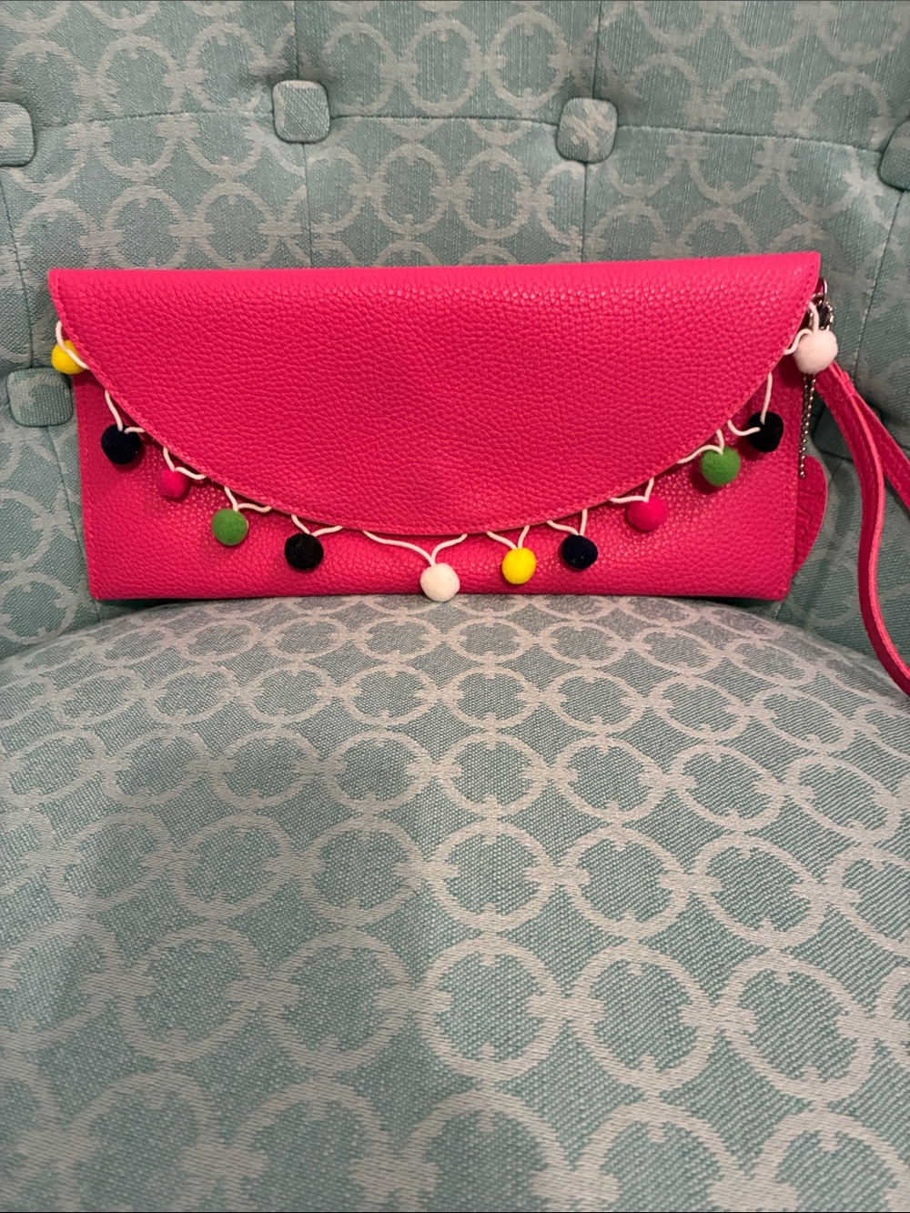 Bright Pink Pom-Pom Wristlet Clutch by Mainstreet Collection.
